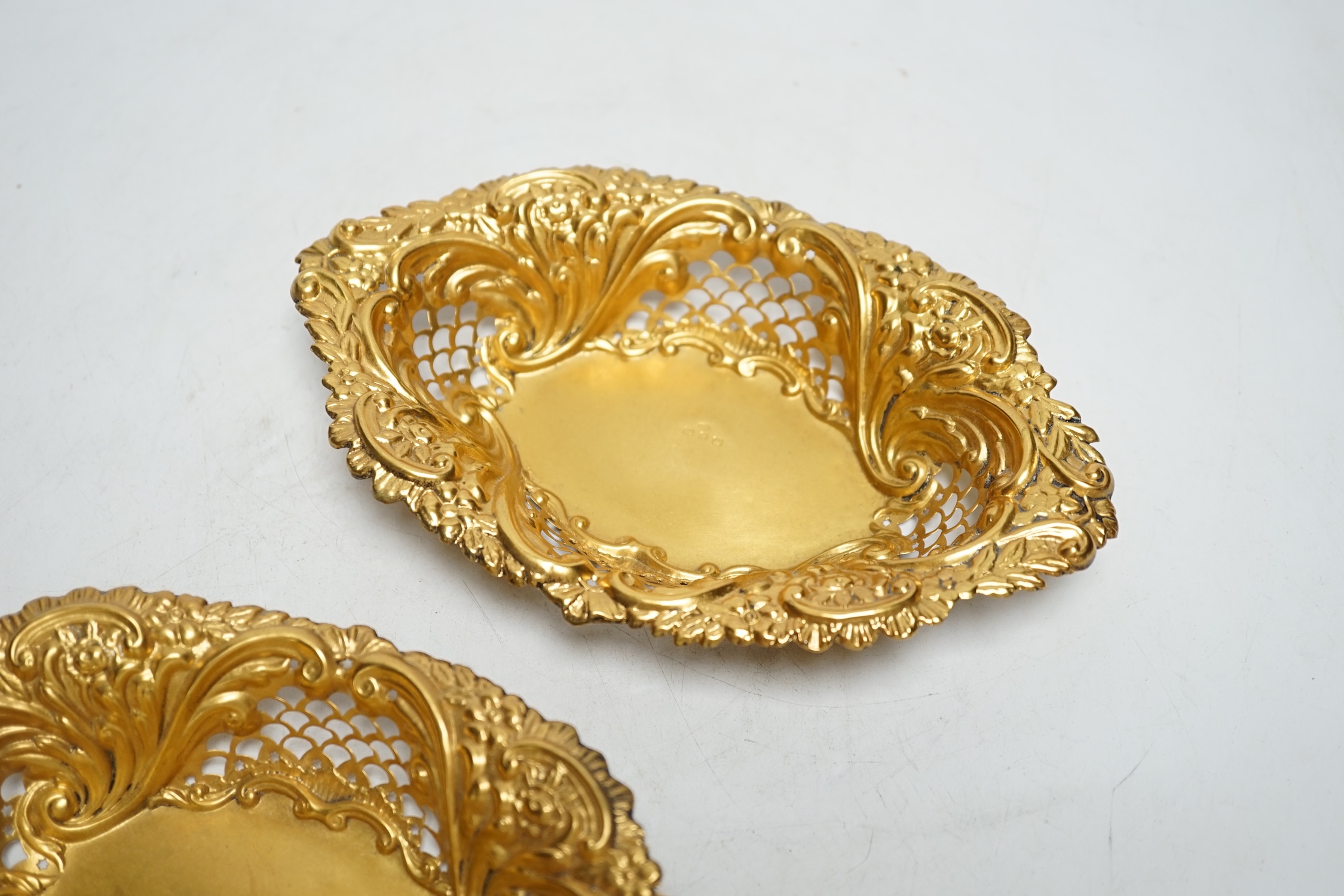A pair of late Victorian matt finish pierced repousse silver gilt oval dishes, Birmingham, 1897, 18.2cm, 3.5oz